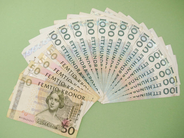 Шведська валюти Sek зі Швеції на синьому фоні - Фото, зображення