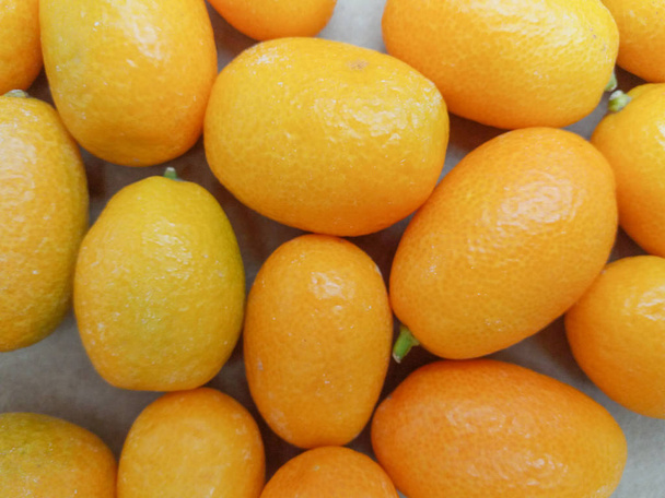 Oválná kumquat (Citrus Margarita nebo Fortunella Margarita) ovoce vegetariánské jídlo - Fotografie, Obrázek