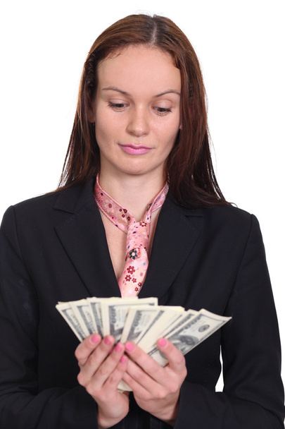 young woman holding a 100 dollar bill - Photo, image