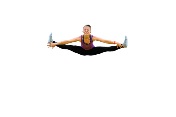 naisten voimistelija hyppää ja tekee halkeamia eristetty valkoinen
 - Valokuva, kuva
