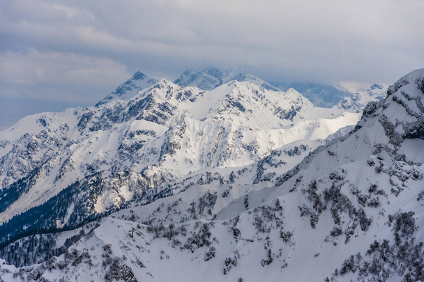 Sochi, Krasnaya Polyana, Caucasus mountains snowy peaks - Photo, image