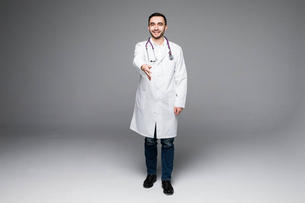 Full length young medical doctor give handshake - 写真・画像
