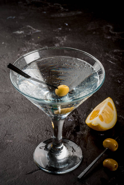 Martini with olives and a lemon - Photo, Image