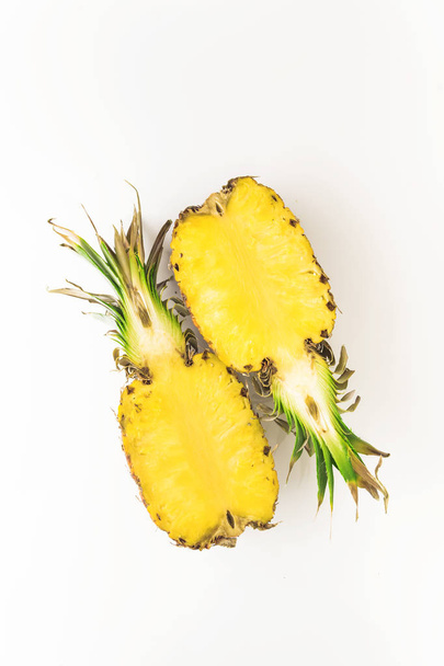 half Cutting fresh pineapple on white background - Фото, зображення