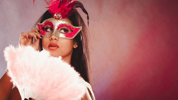woman with carnival mask holds fan - Valokuva, kuva