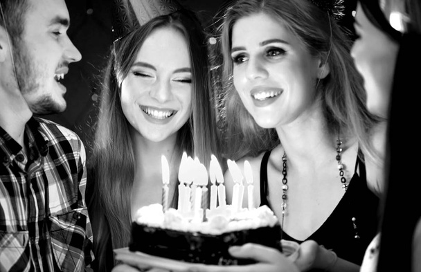 Black white pictures of happy friends birthday party candle cakes. - Photo, Image