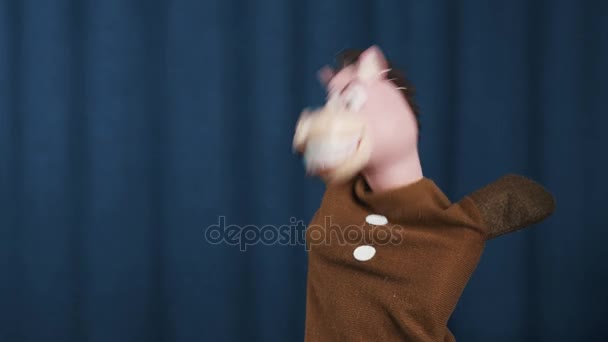 Horse hand puppet shaking an spinning head on scene with blue background - Footage, Video