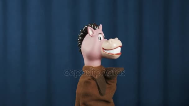 Horse hand puppet nodding head and shaking on scene with blue background - Footage, Video
