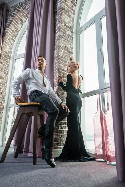 Young beautiful couple in a suit and evening gown - Photo, Image