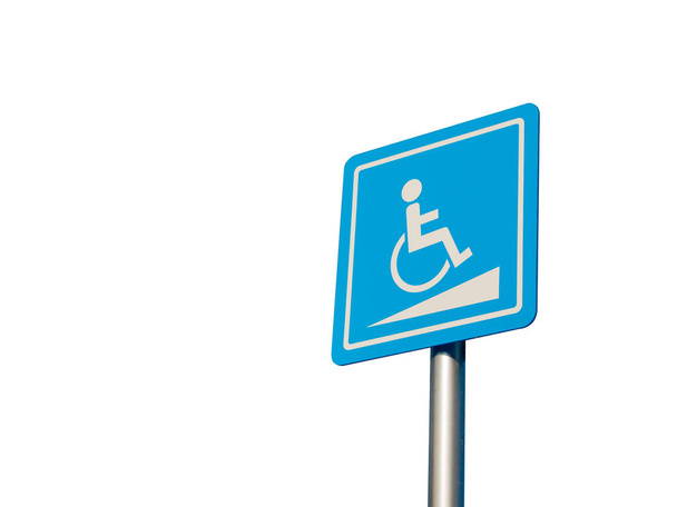 Disabled parking space and wheelchair way sign and symbols on a pole warning motorists isolate on white background - Photo, Image