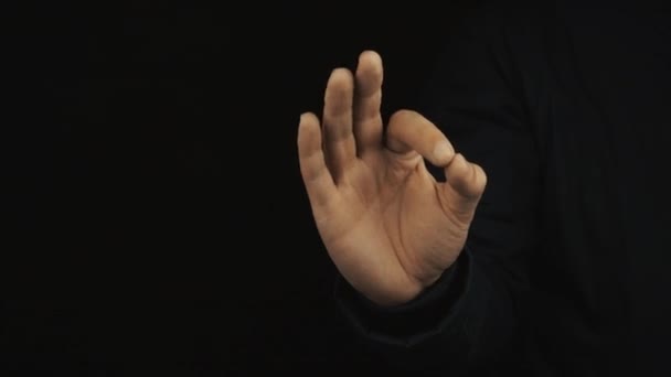 Male hand in long sleeve jacket make variety of positive finger gestures - Záběry, video