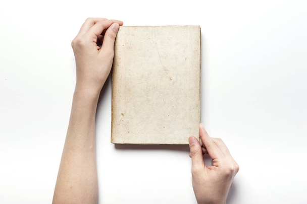 holding a asian vintage book isolated white. - Foto, afbeelding