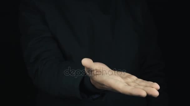 Male hand in long sleeve jacket rubbing fingers together, get money and count it - Filmmaterial, Video