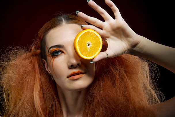Girl with red hair and orange - Fotoğraf, Görsel