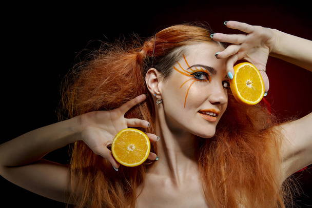 Girl with red hair and orange - Foto, Imagen
