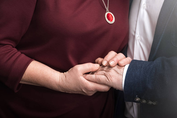 Couple holding hands - Fotó, kép
