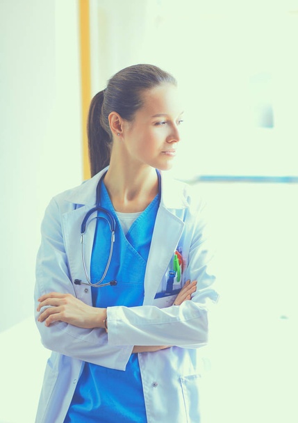Woman doctor standing near window at hospital - Foto, Imagem
