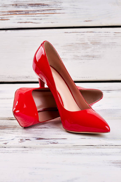 Red shoes on wood. - Fotografie, Obrázek