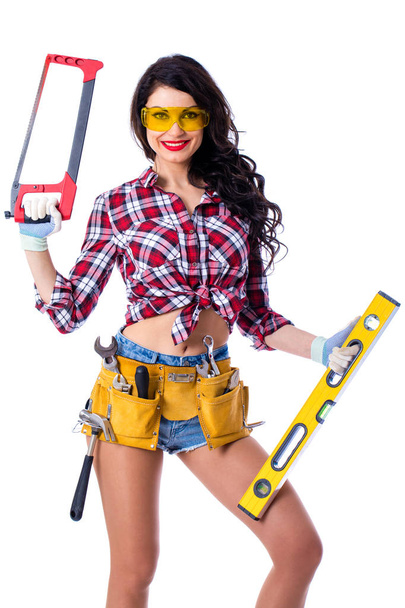 Sexy brunette woman mechanic with a wrench - Φωτογραφία, εικόνα
