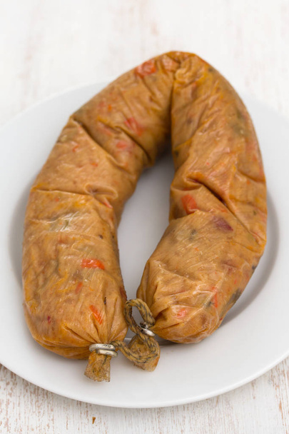 vegetarian smoked sausage on plate - Фото, зображення