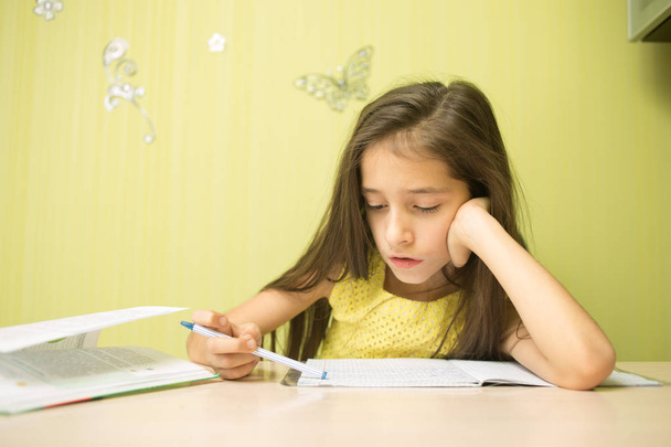 clever girl doing homework - Фото, изображение