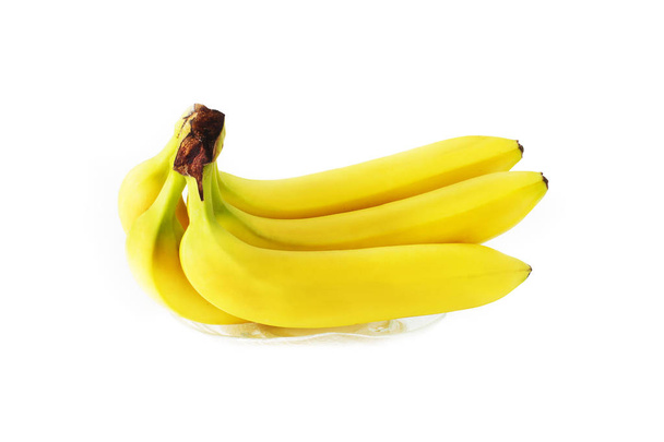 Yellow bananas on white background - Foto, afbeelding