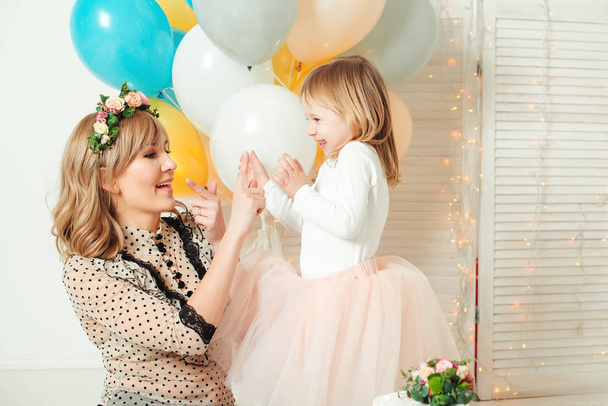 Happy mom playing with her little daughter. Birthday concept. Mother's day concept. - Foto, imagen