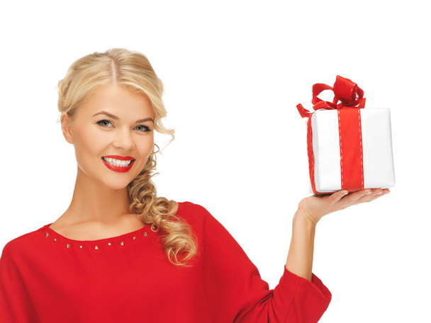 Lovely woman in red dress with present - Foto, Imagen