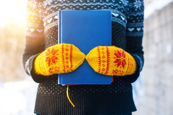 Books on the background of knitted sweaters. - Photo, Image