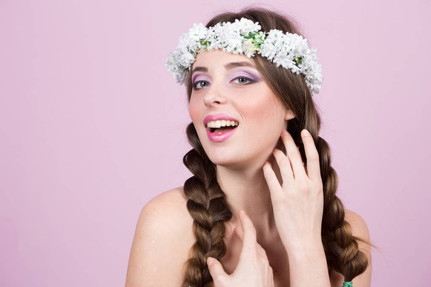 young model with bright flowers on her head - Photo, Image