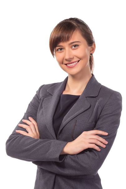 Mujer de negocios sonriente o maestra con el brazo doblado aislado
 - Foto, imagen