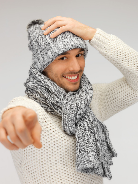Man in winter clothes pointing his finger - Foto, Imagen