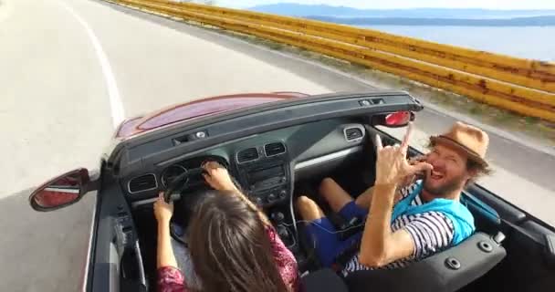 man riding with friend in convertible - Footage, Video