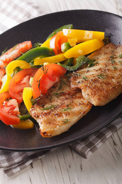 Grilled fish steaks and fresh vegetable salad close-up. vertical - Photo, Image