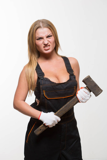 Nice sexy woman mechanic holding wrench isolated over white background - Foto, Imagem