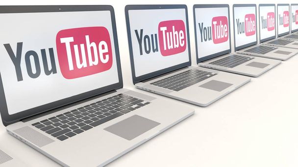 Modern laptops with YouTube logo. Computer technology conceptual editorial 3D rendering - Φωτογραφία, εικόνα