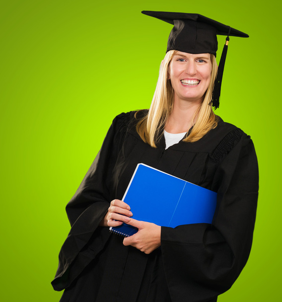 Щаслива випускниця тримає блокнот
 - Фото, зображення