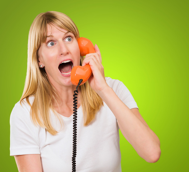 shocked woman talking on telephone - Photo, Image