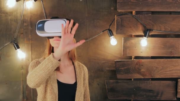 Young woman using Virtual Reality Glasses - Footage, Video