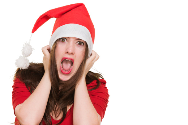 furious woman wearing a christmas hat - Фото, изображение