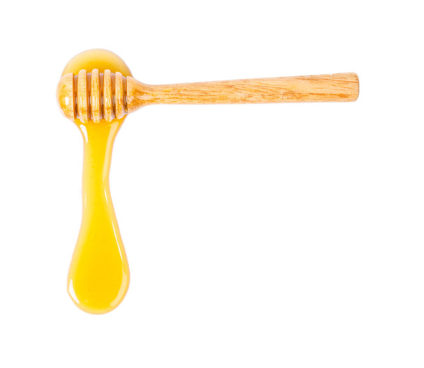 Honey dripping isolated on white - Photo, image