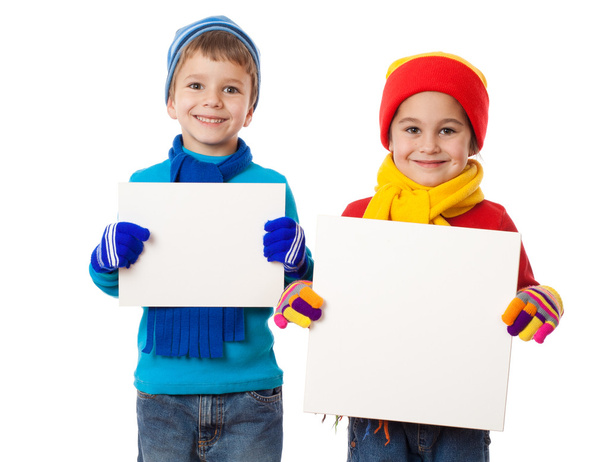 Kids in winter clothes with empty blanks - Foto, immagini