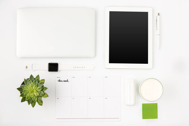 Top view of white office table with laptop - 写真・画像