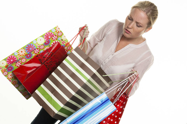 woman with colorful shopping bags - Fotó, kép