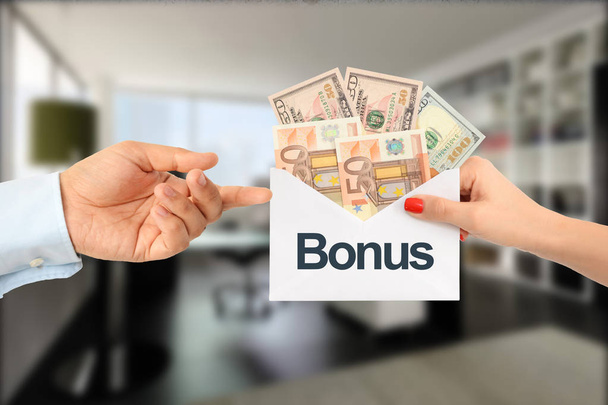 Bonus pay or extra payment to an efficient employee concept - Photo, Image