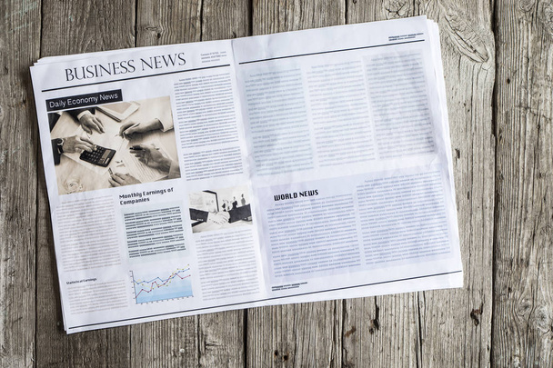 Newspaper on wooden table - Photo, Image