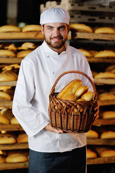 young boy holding a basket with bakery products - Photo, Image
