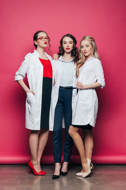 young stylish women in white coats - 写真・画像