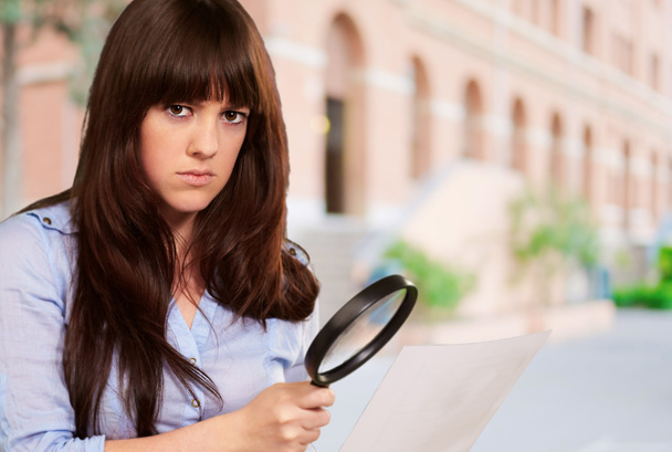 Portrait Of A Girl Holding A Magnifying Glass And Paper - Photo, Image