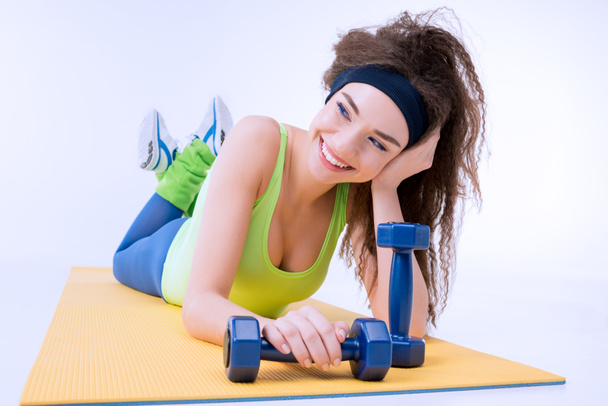 sporty woman with dumbbells  - Photo, Image
